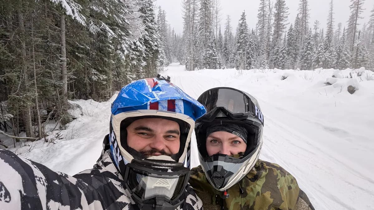 Giovanni and his girlfriend on a snowmobile