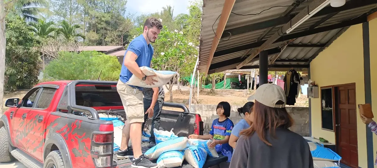 Giovanni unloading rice from Ford Ranger